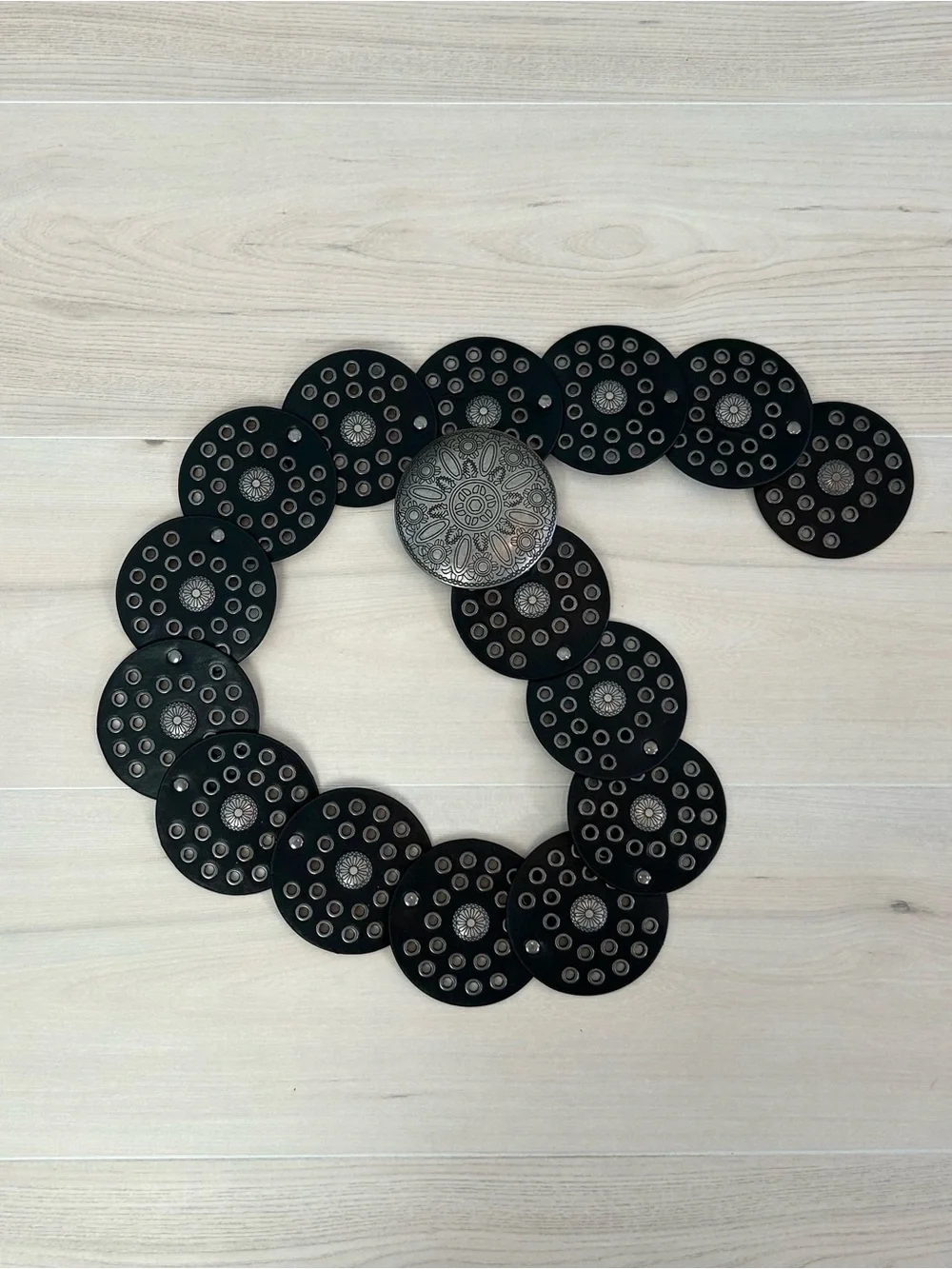 black and silver disk belt
